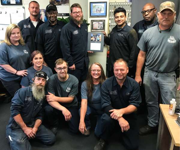 John and Melinda Bray group photo with employees