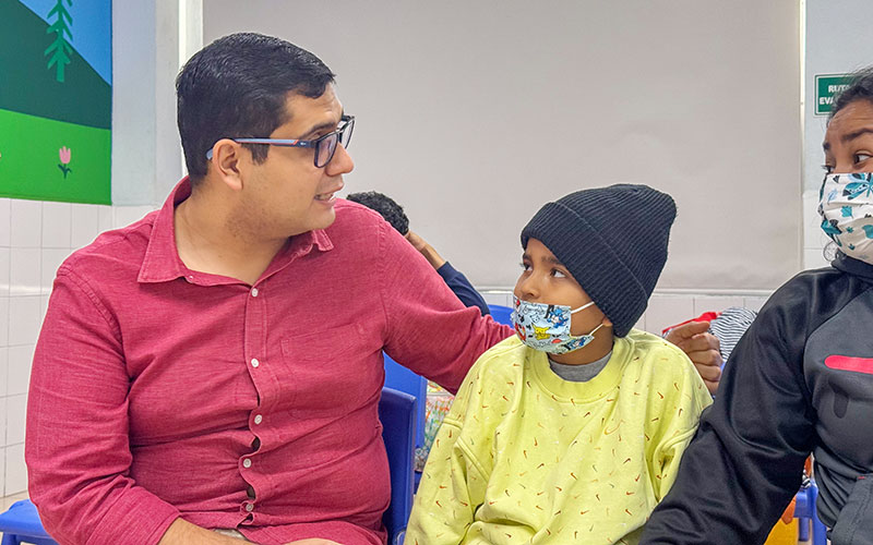 A man and a boy in face mask.