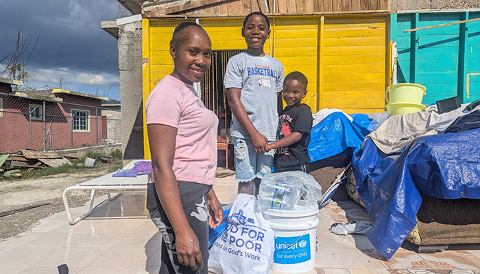 Family affected by Hurricane Melissa received essential supplies.
